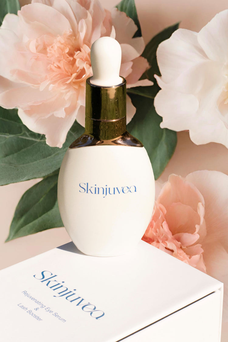Skinjuvea Anti-Aging Eye Serum and Lash Booster bottle with flowers