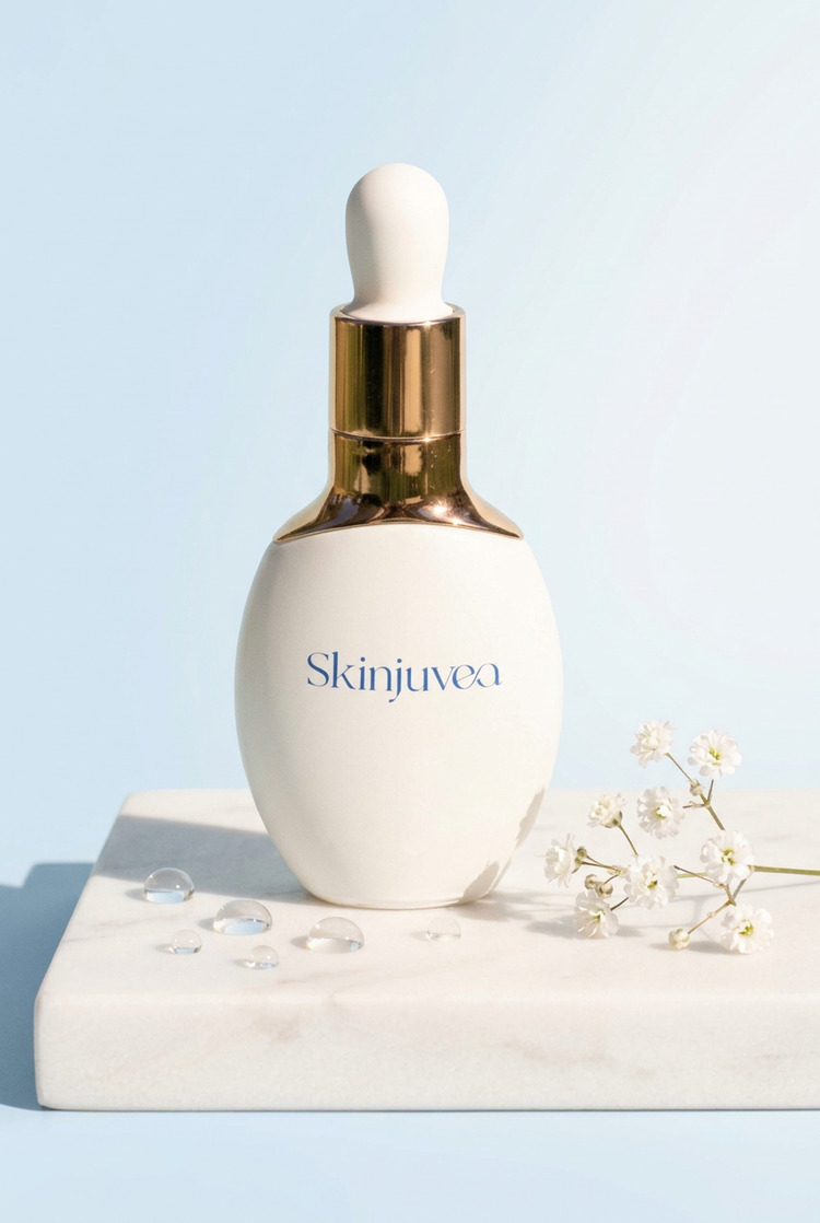 Skinjuvea Anti-Aging Eye Serum bottle on a white marble stand with baby's breath flowers